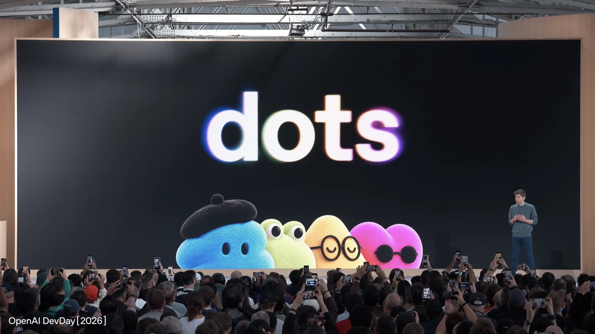 OpenAI DevDay stage displaying Dots above four colorful agent characters